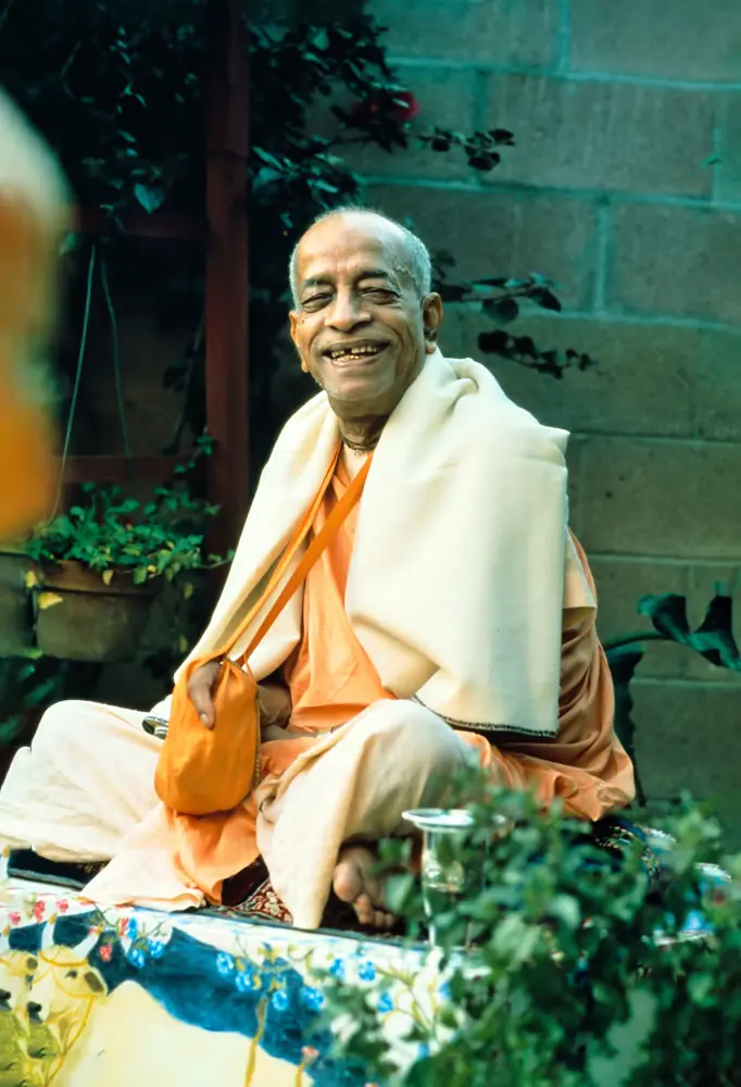 Prabhupada Smiling Sitting in Garden Chanting Japa