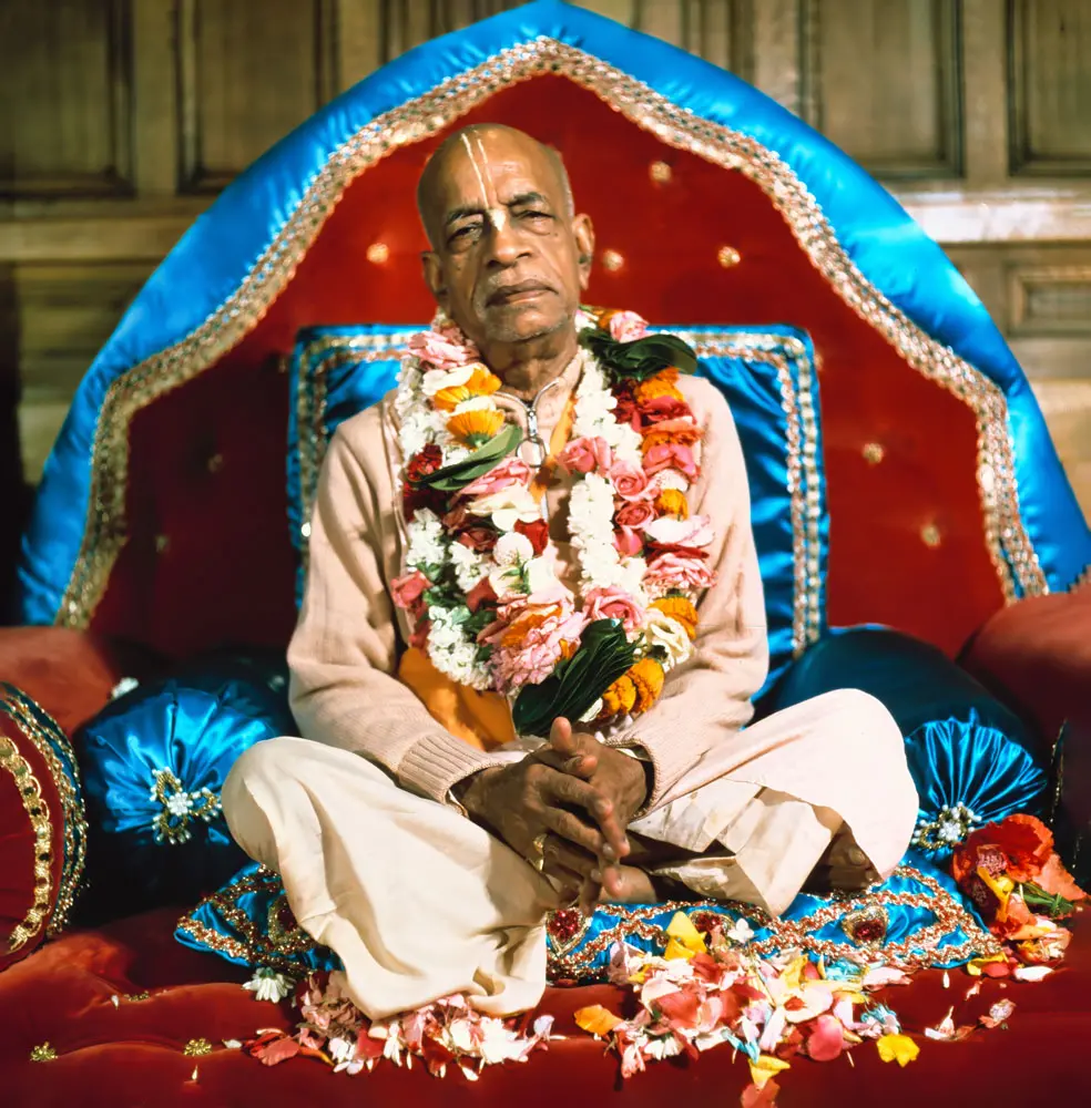 Srila Prabhupada in London on Red and Blue Vyasasana with Folded Hands