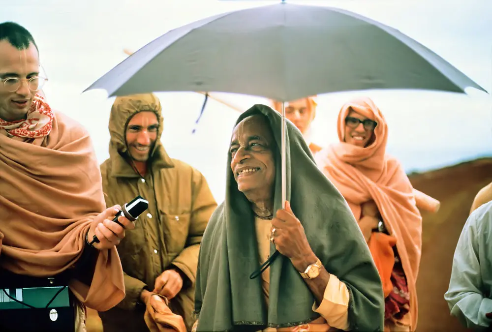 Prabhupada Smiling on Morning Walk with Disciples