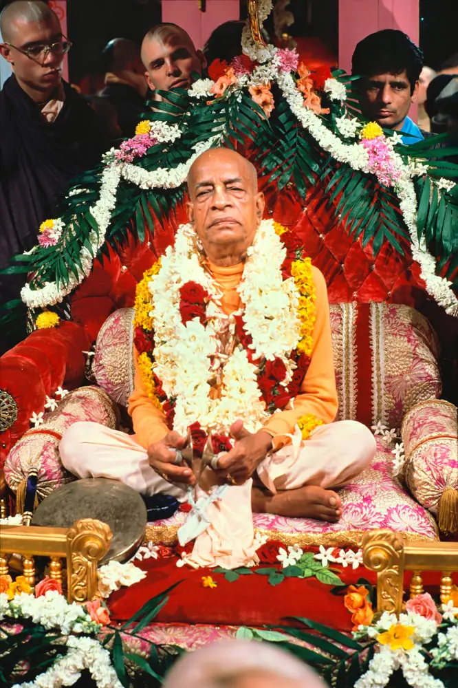 Prabhupada Leading Kirtan Playing Kartals on Red Vyasasana