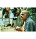 Srila Prabhupada Leads Kirtan Outside Sitting on Grass