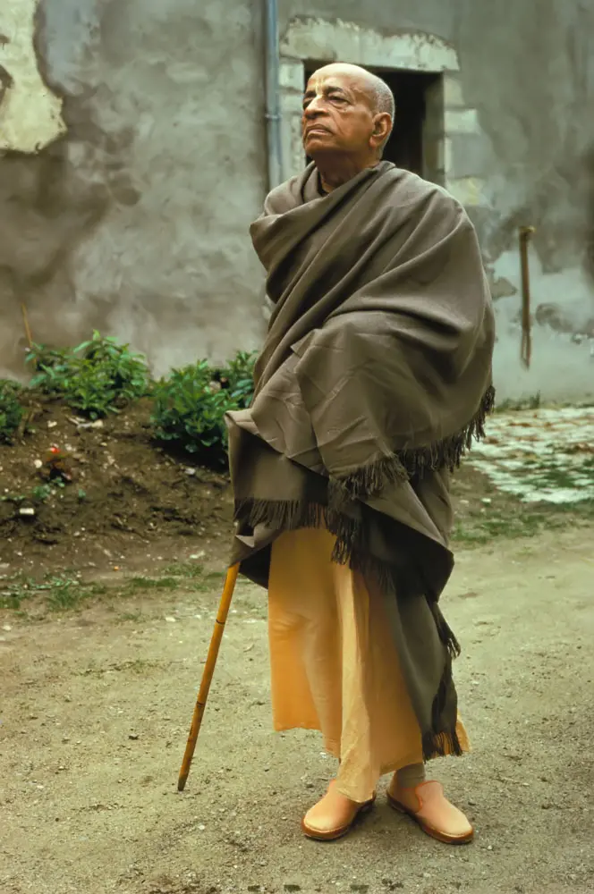 Srila Prabhupada in a very Stately Pose Outside Old Building