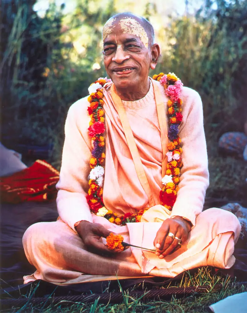 Srila Prabhupada in France, Holding a Marigold Flower